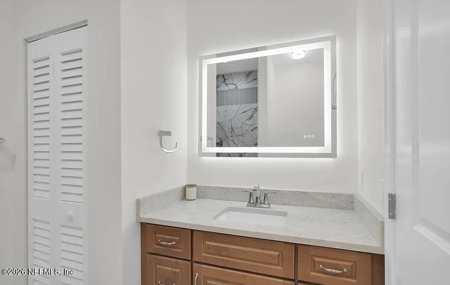 159 Mays Cove Road East Palatka, FL 32131 - Photo 23 of 49 a bathroom with a granite countertop sink and a mirror