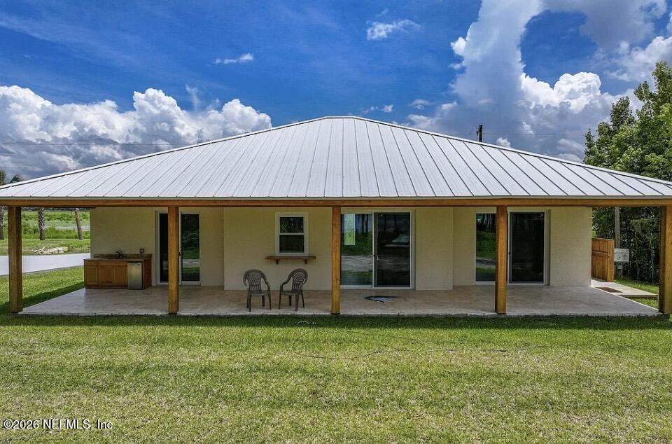 159 Mays Cove Road East Palatka, FL 32131 - Photo 25 of 49 a front view of a house with garden