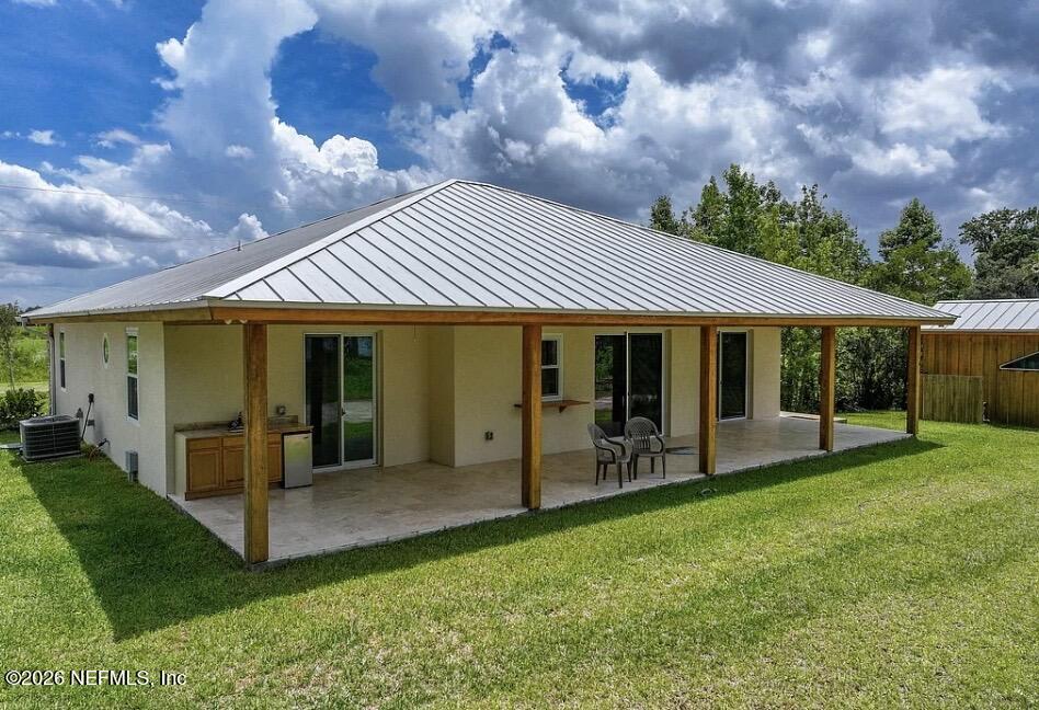 159 Mays Cove Road East Palatka, FL 32131 - Photo 26 of 49 a view of a house with a yard porch and sitting area