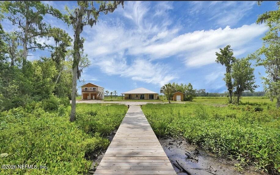 159 Mays Cove Road East Palatka, FL 32131 - Photo 33 of 49 a view of a pathway with a big yard