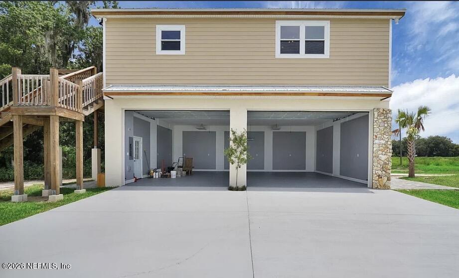 159 Mays Cove Road East Palatka, FL 32131 - Photo 35 of 49 a view of a house with porch and garden
