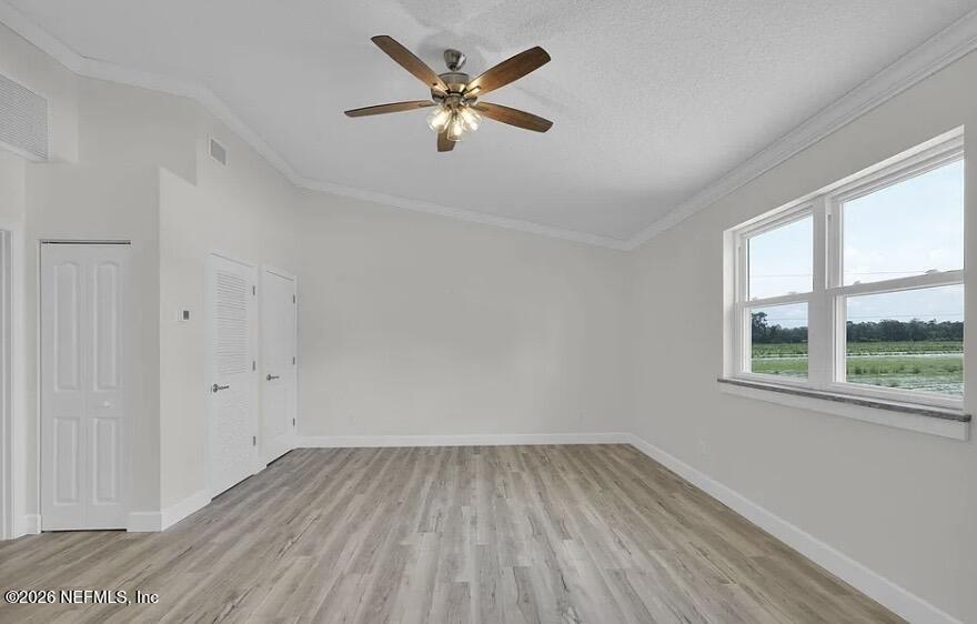 159 Mays Cove Road East Palatka, FL 32131 - Photo 46 of 49 wooden floor in an empty room with a window