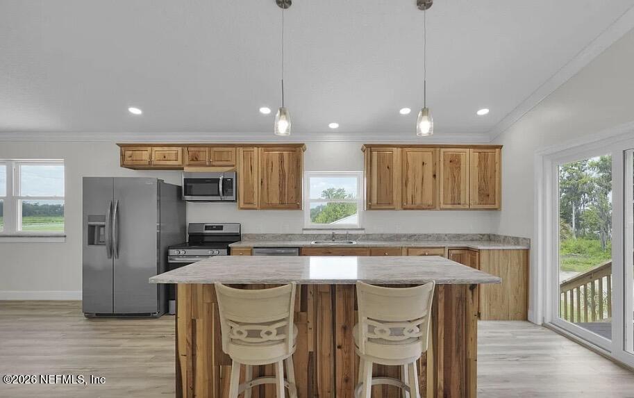 159 Mays Cove Road East Palatka, FL 32131 - Photo 47 of 49 a kitchen with a table chairs refrigerator and microwave