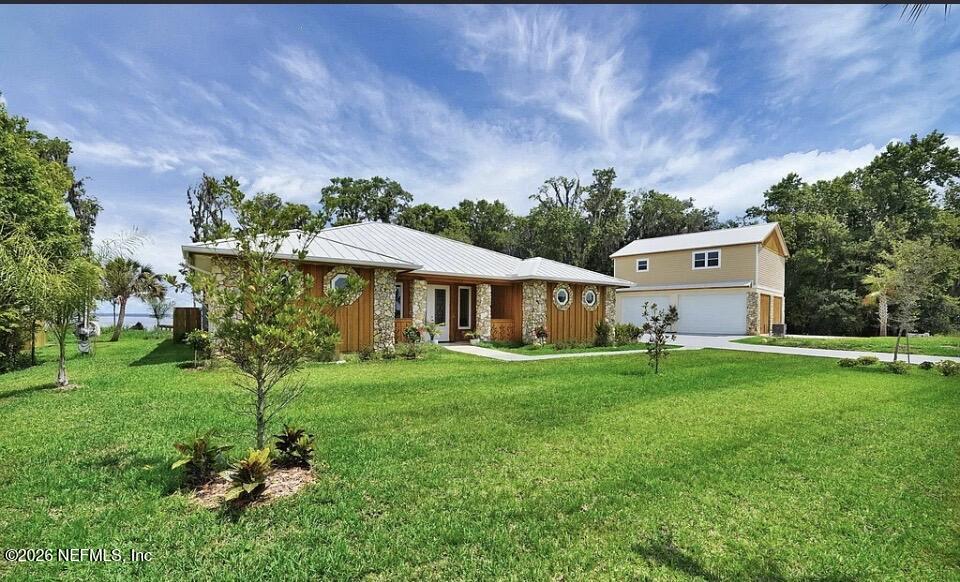 159 Mays Cove Road East Palatka, FL 32131 - Photo 5 of 49 a front view of a house with garden