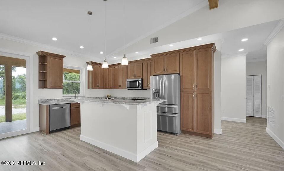 159 Mays Cove Road East Palatka, FL 32131 - Photo 7 of 49 a kitchen with stainless steel appliances granite countertop a refrigerator a stove and a wooden floors