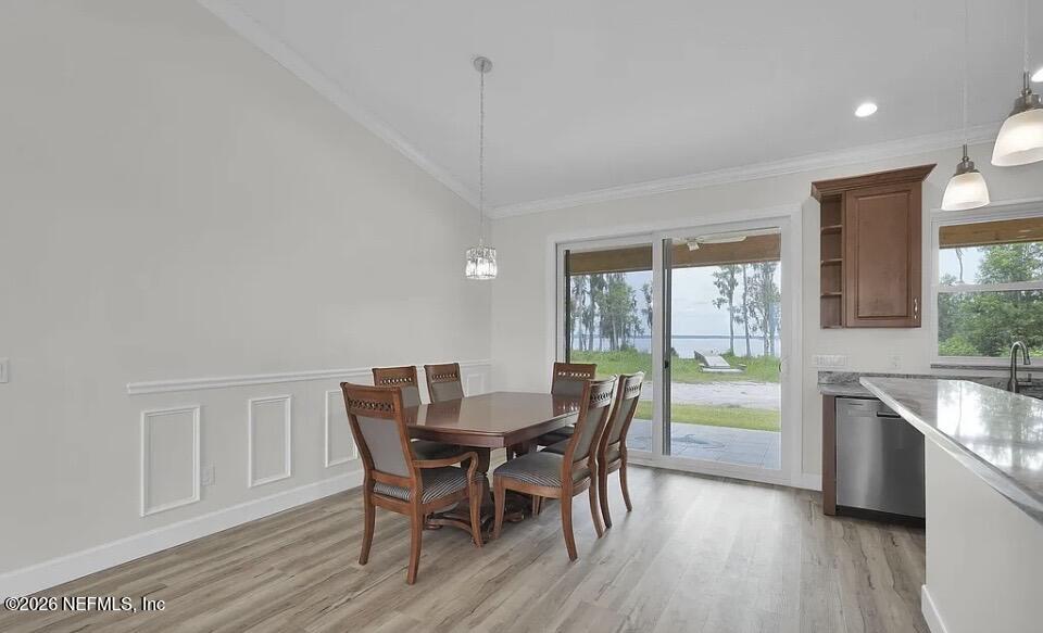 159 Mays Cove Road East Palatka, FL 32131 - Photo 9 of 49 a view of a dining room with furniture window and wooden floor