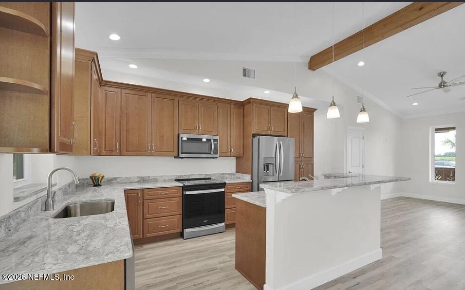159 Mays Cove Road East Palatka, FL 32131 - Photo 10 of 49 a kitchen with kitchen island a sink stainless steel appliances and cabinets