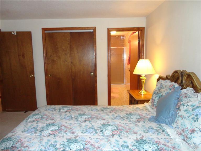 140 Cedric Road Centerville, MA 02632 - Photo 13 of 17 a bed room with a bed and a lamp