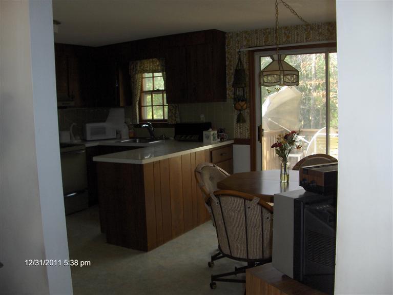 140 Cedric Road Centerville, MA 02632 - Photo 5 of 17 a view of a workspace with furniture and a window