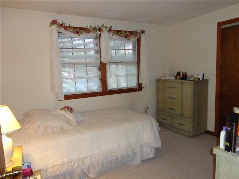 140 Cedric Road Centerville, MA 02632 - Photo 10 of 17 a bedroom with a bed and a cabinets