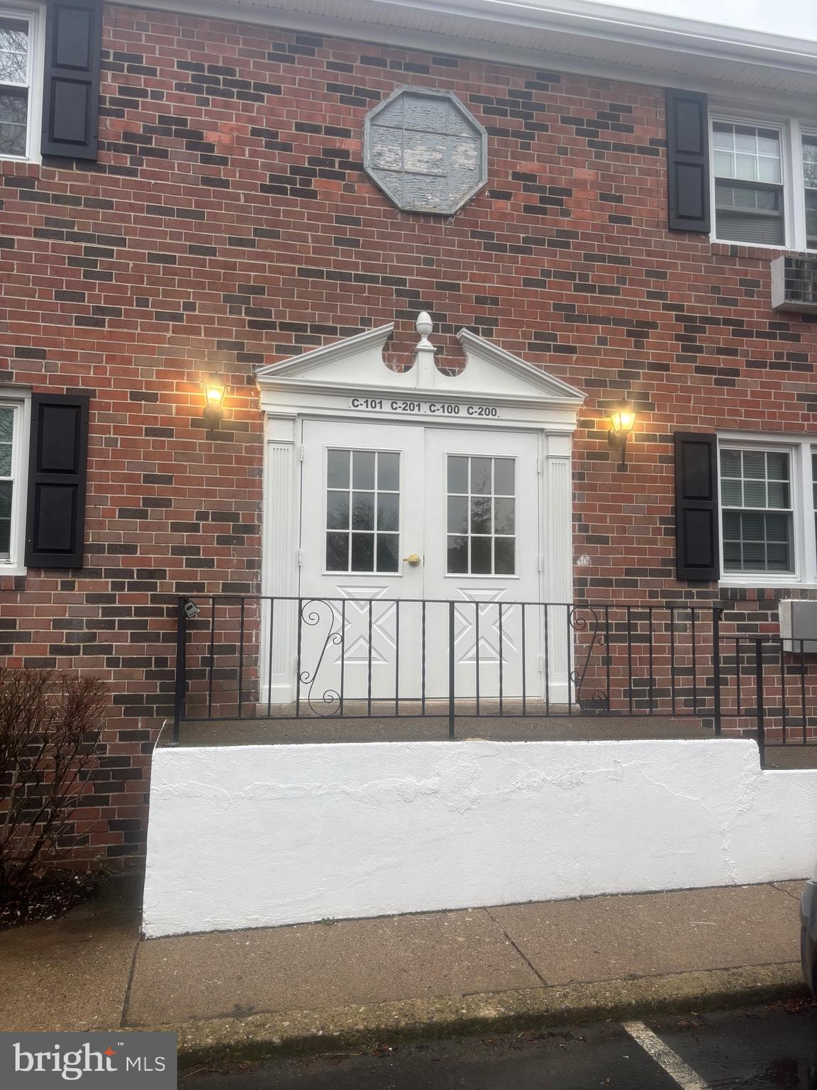 a front view of a building with windows