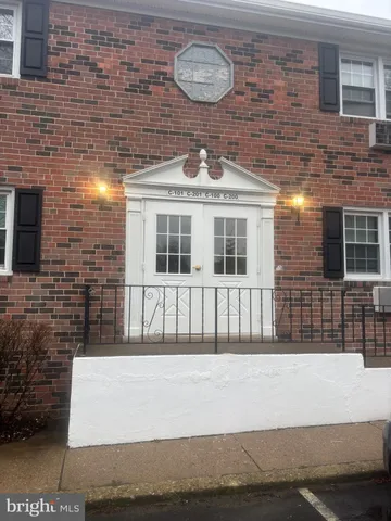 a front view of a building with windows