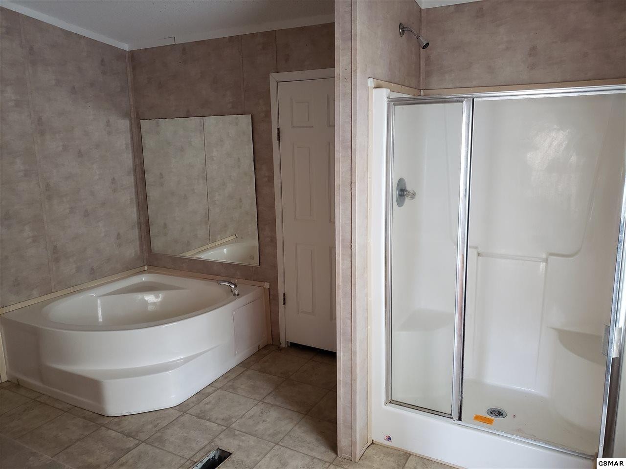 1033 Beard Valley Road Maynardville, TN 37807 - Photo 12 of 22 a spacious bathroom with a bathtub and shower