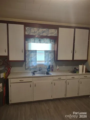 a kitchen with a sink and cabinets