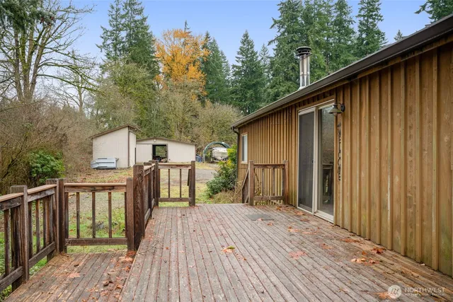a view of a house with a wooden deck