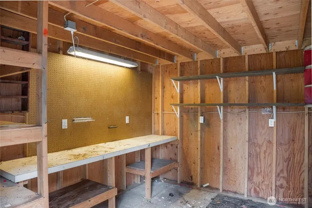 a view of entryway with wooden walls