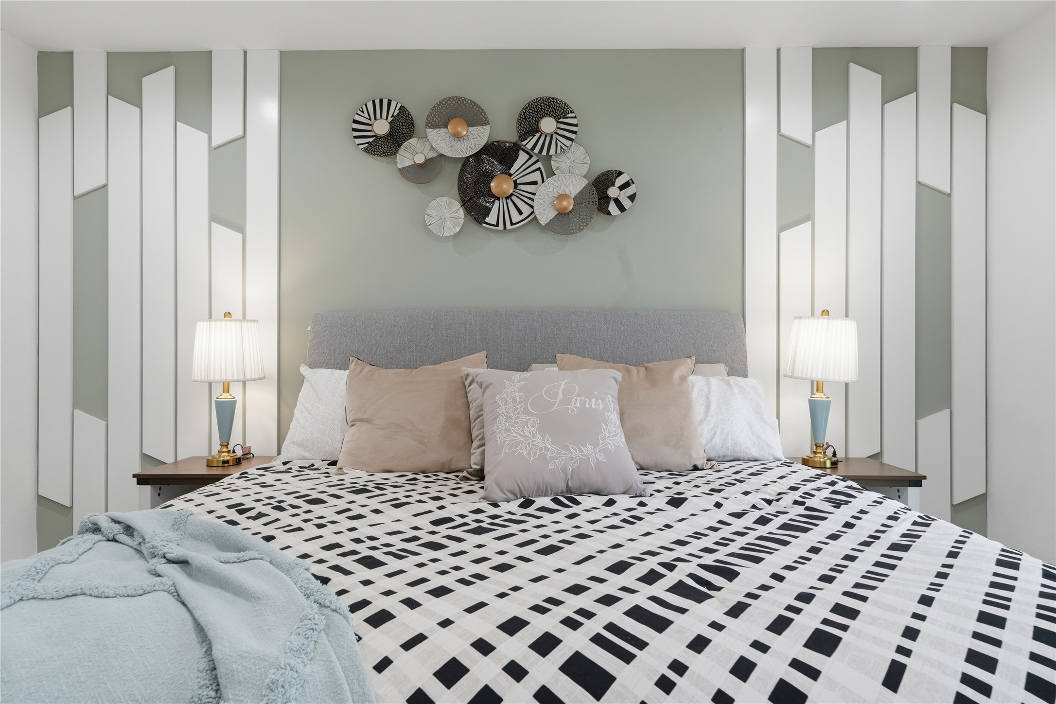 5604 Coventry Lane Austin, TX 78723 - Photo 19 of 33 Accent wall featuring geometric paneling and a central decorative art piece