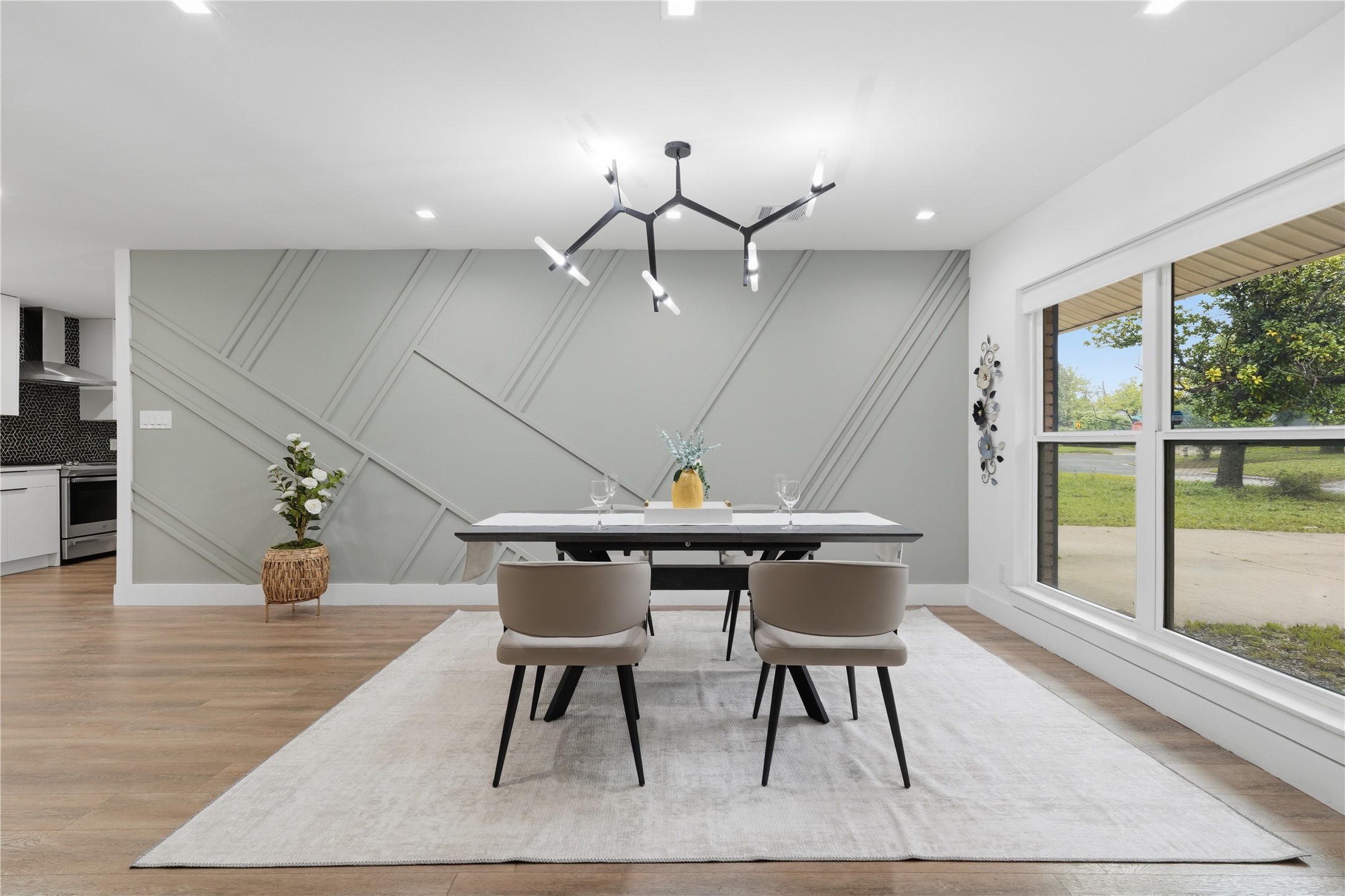 5604 Coventry Lane Austin, TX 78723 - Photo 3 of 33 Dining area with an accent wall featuring geometric paneling