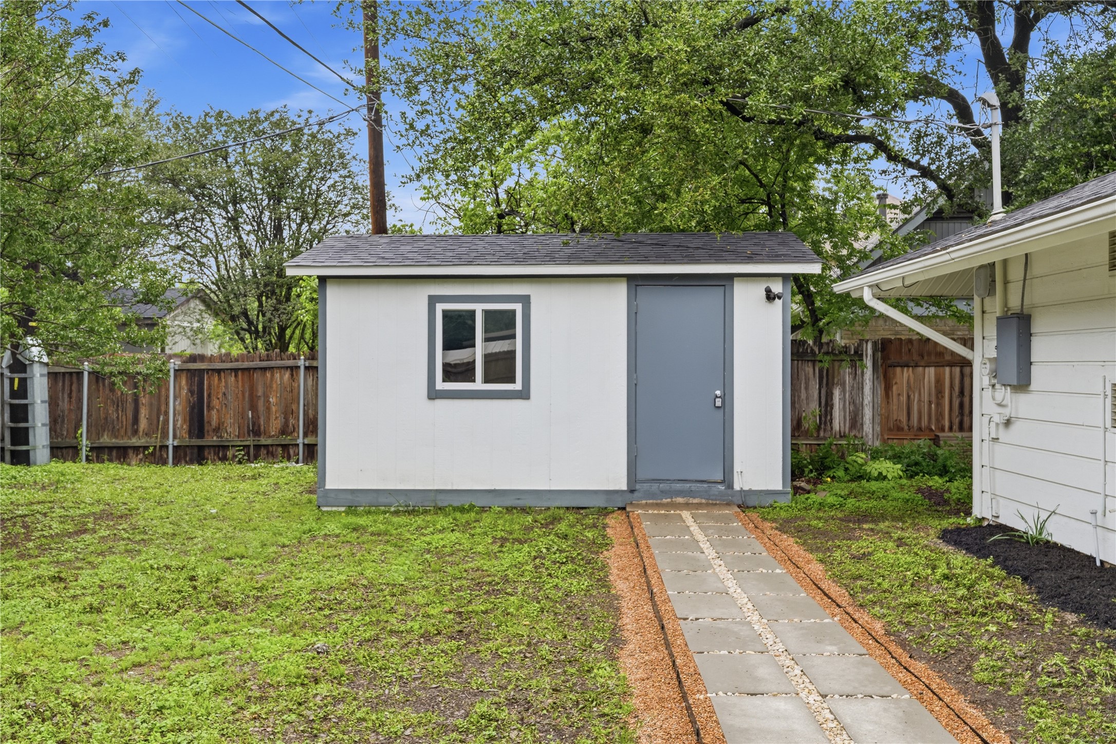 5604 Coventry Lane Austin, TX 78723 - Photo 31 of 33 Detached storage shed featuring a single window and a solid door