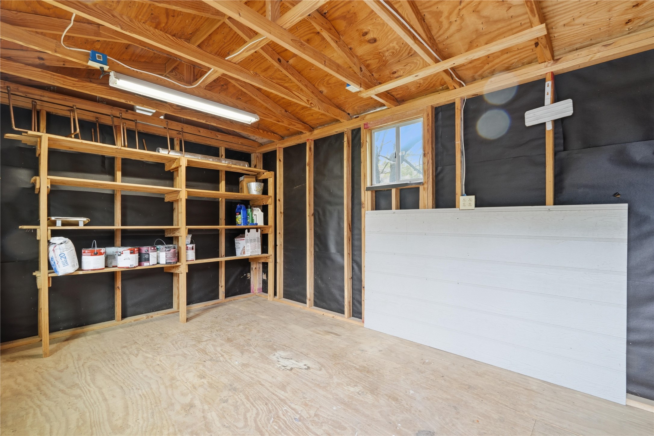 5604 Coventry Lane Austin, TX 78723 - Photo 32 of 33 Utility shed interior featuring exposed wooden rafters and framing