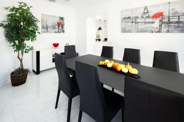 a workspace with furniture and potted plant