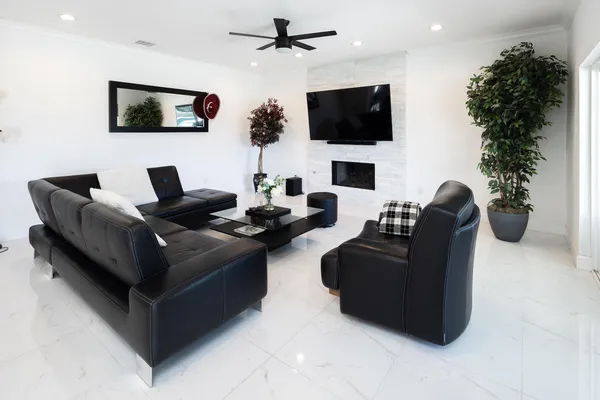a living room with furniture and a flat screen tv