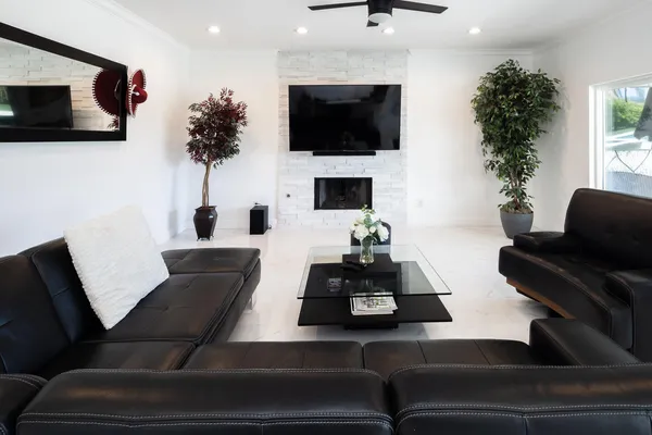 a living room with furniture and a flat screen tv