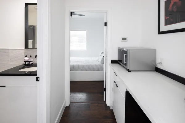 a bathroom with a bathtub sink and mirror