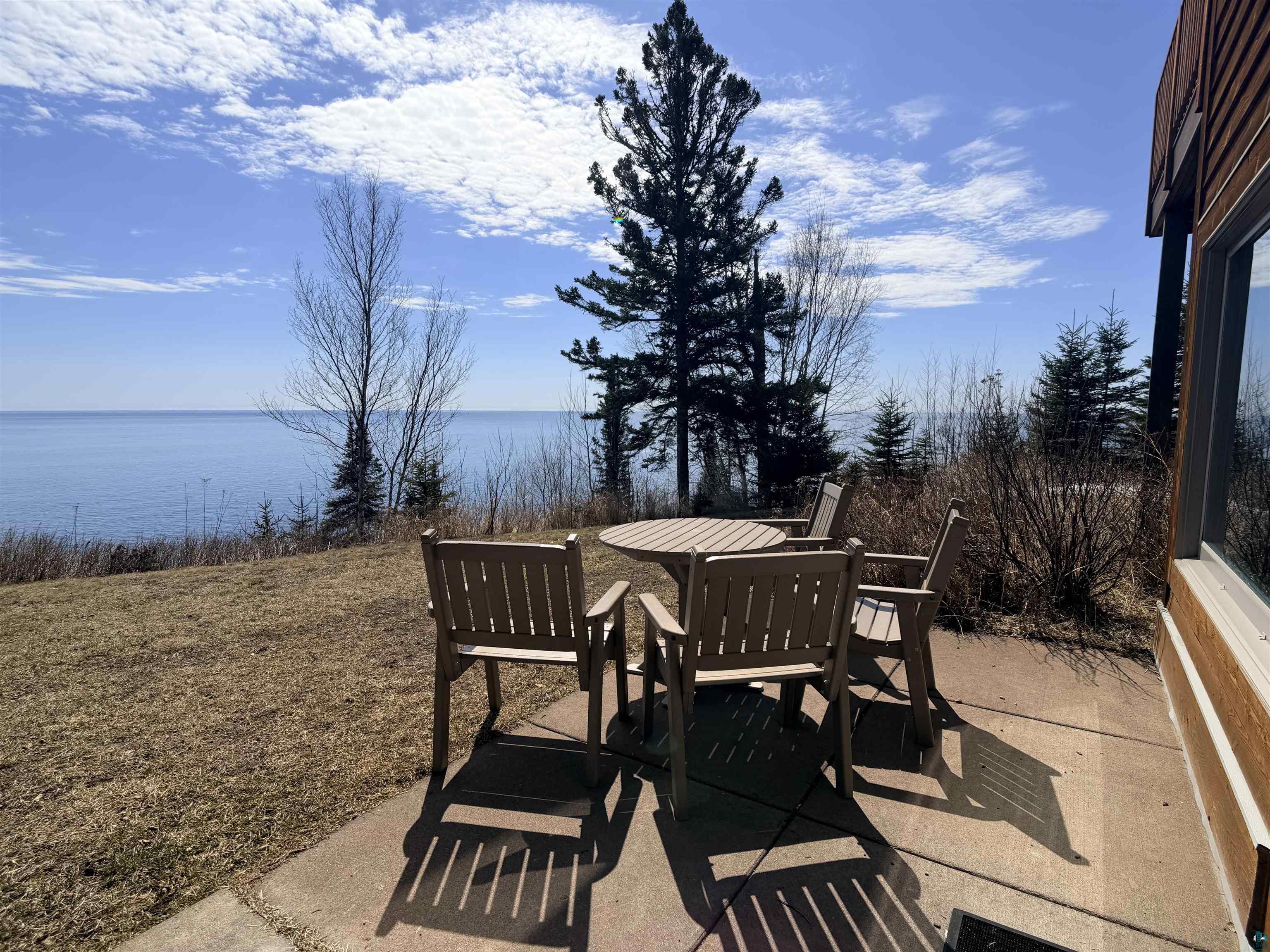 504-506 Poplar River Road, Unit 505 Lutsen, MN 55612 - Photo 35 of 39 Concrete patio with a water backdrop