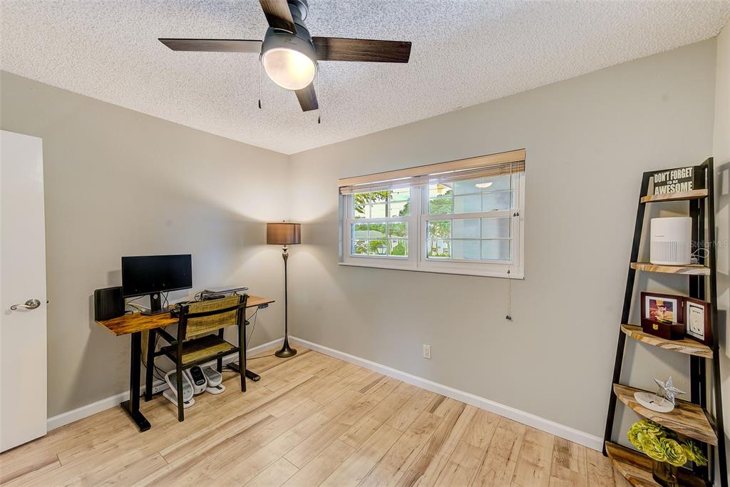 12900 Vonn Road, Unit E205 Largo, FL 33774 - Photo 19 of 35 a view of a workspace with furniture and a window