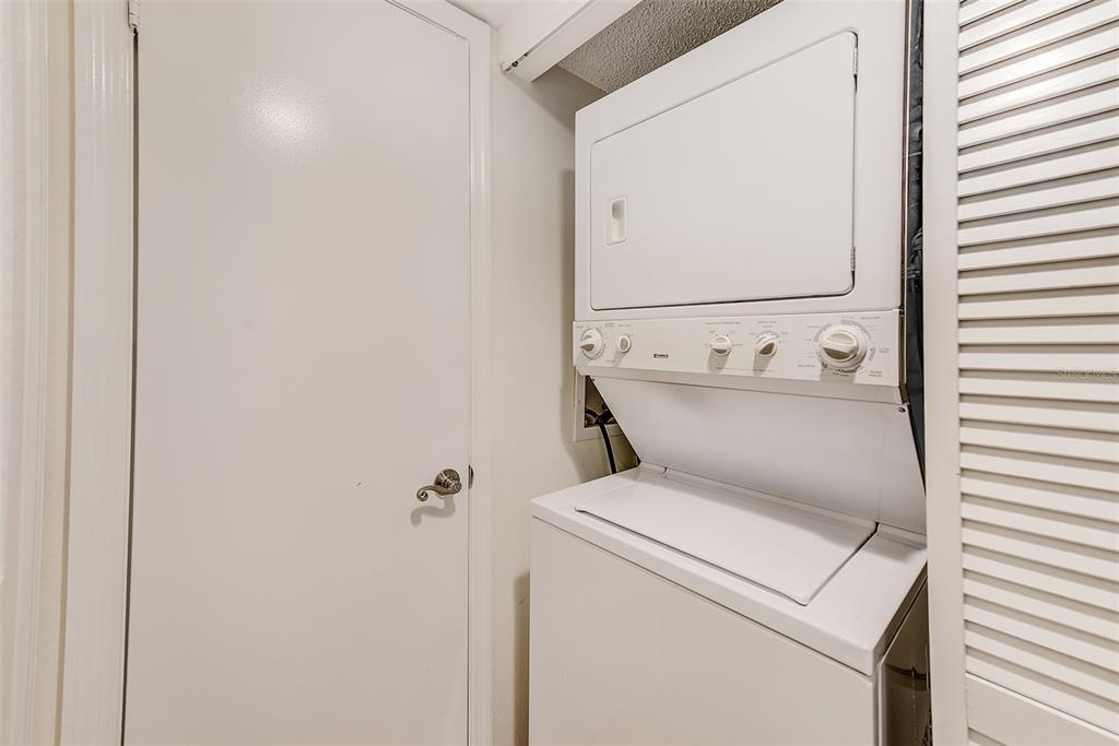 12900 Vonn Road, Unit E205 Largo, FL 33774 - Photo 21 of 35 a utility room with dryer and washer