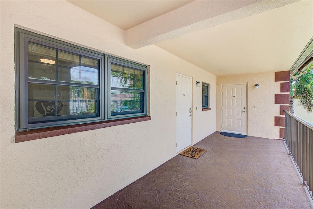 12900 Vonn Road, Unit E205 Largo, FL 33774 - Photo 25 of 35 a view of a hallway with a window