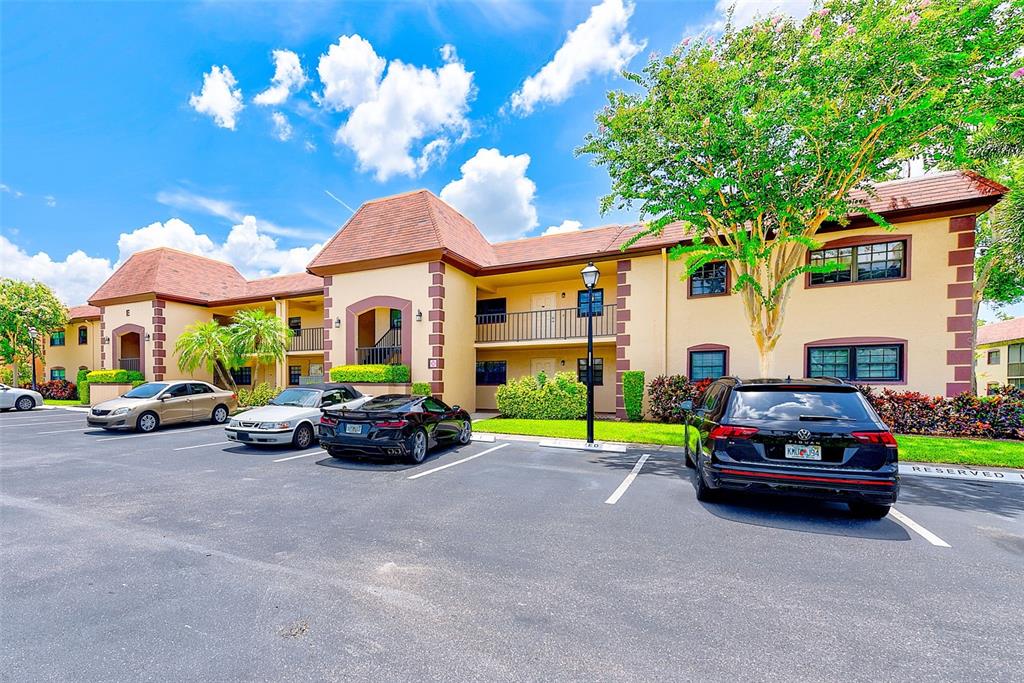 12900 Vonn Road, Unit E205 Largo, FL 33774 - Photo 26 of 35 a car parked in front of a house