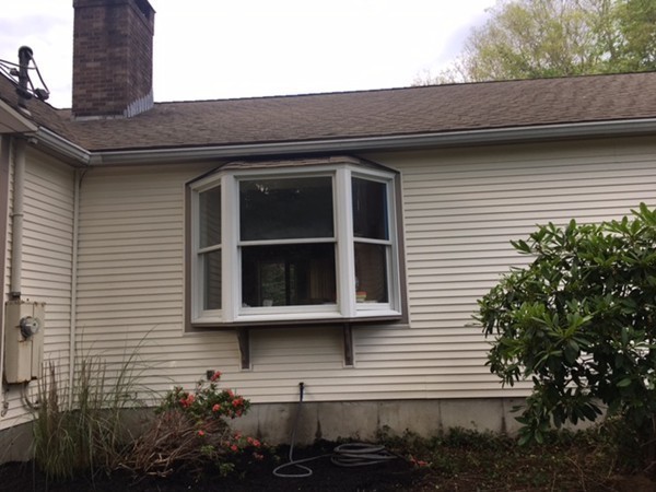 41 Diandy Road Bourne, MA 02562 - Photo 5 of 17 a front view of a house with a yard