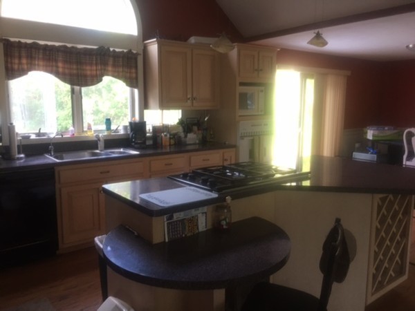 41 Diandy Road Bourne, MA 02562 - Photo 10 of 17 a kitchen with a table chairs and a sink