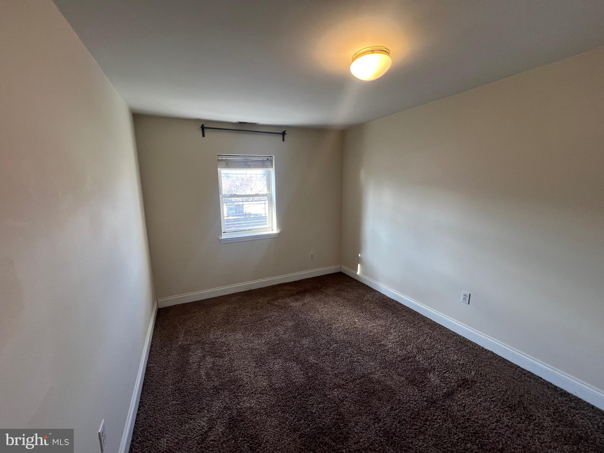 4127 Cresson Street, Unit 2F Philadelphia, PA 19127 - Photo 9 of 14 wooden floor in an empty room with a window