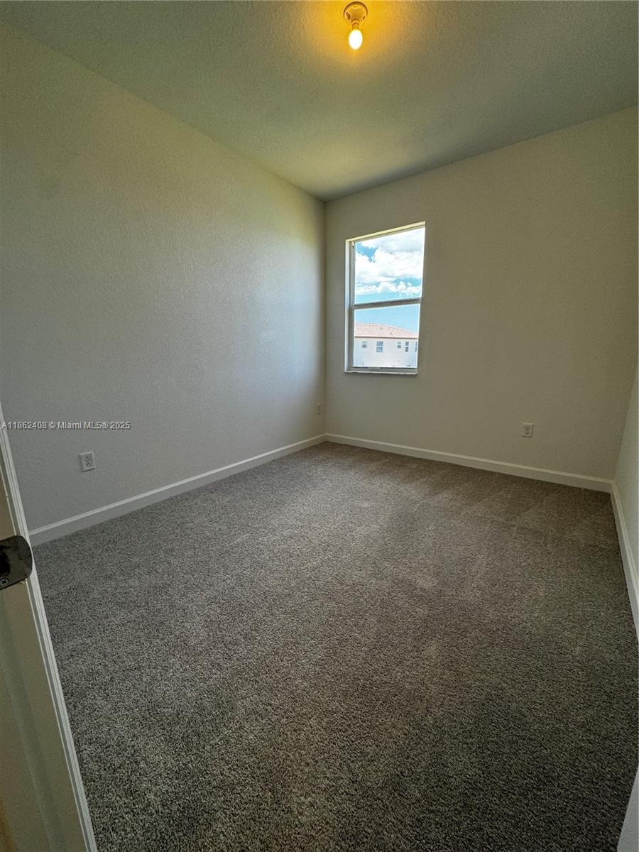 2325 Northwest 125 Street, Unit 2325 Miami, FL 33167 - Photo 16 of 18 an empty room with a window