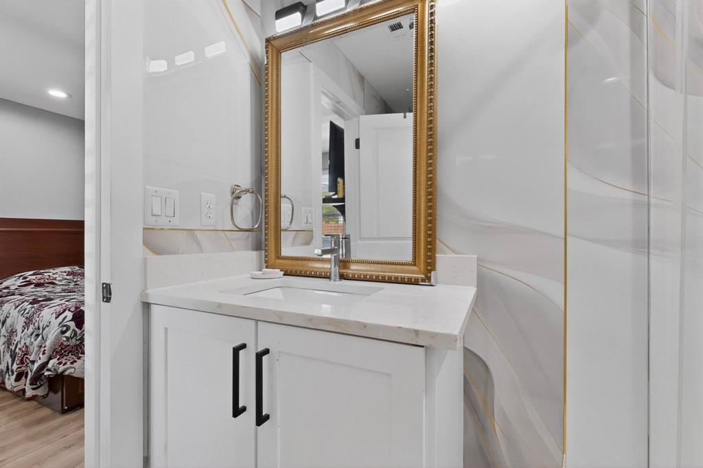 602 North Bagdad Road Grand Prairie, TX 75050 - Photo 25 of 39 a bathroom with a sink and a mirror