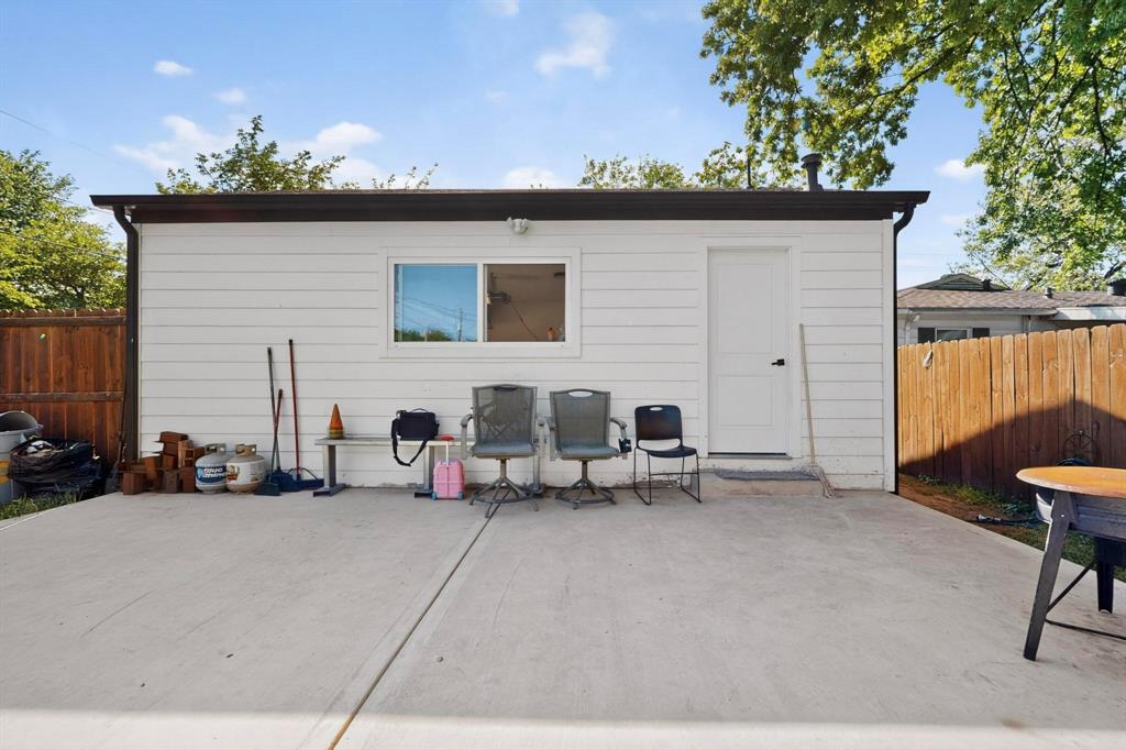602 North Bagdad Road Grand Prairie, TX 75050 - Photo 32 of 39 a backyard of a house with table and chairs