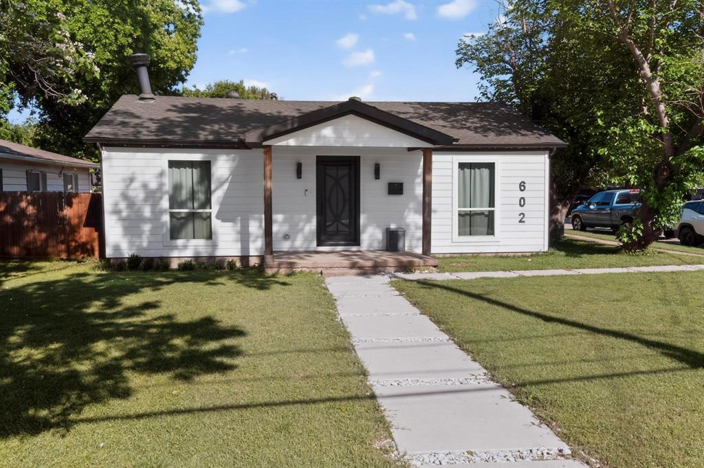 602 North Bagdad Road Grand Prairie, TX 75050 - Photo 10 of 39 a front view of a house with garden