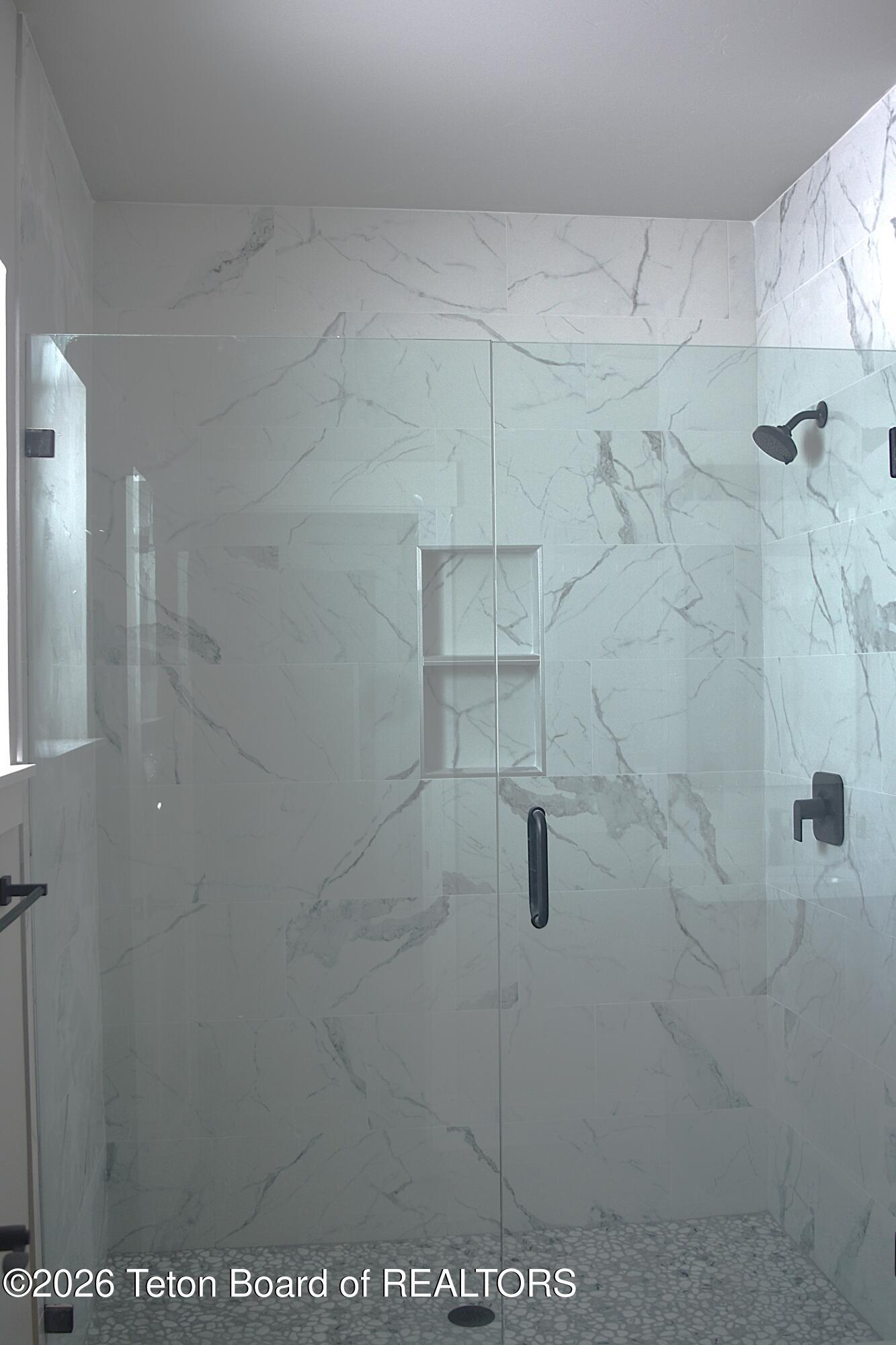 626 Little Greys Loop Etna, WY 83118 - Photo 14 of 16 626 Little Greys Loop Master Bath Shower