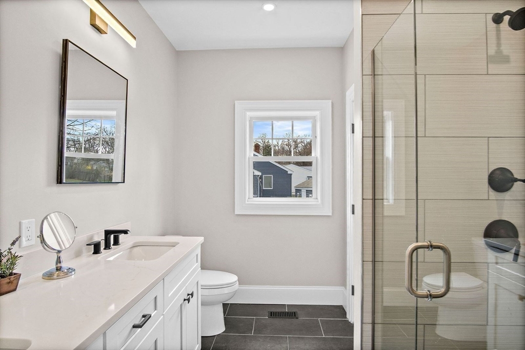 43 Samoset Road Woburn, MA 01801 - Photo 13 of 30 a bathroom with a sink toilet and shower