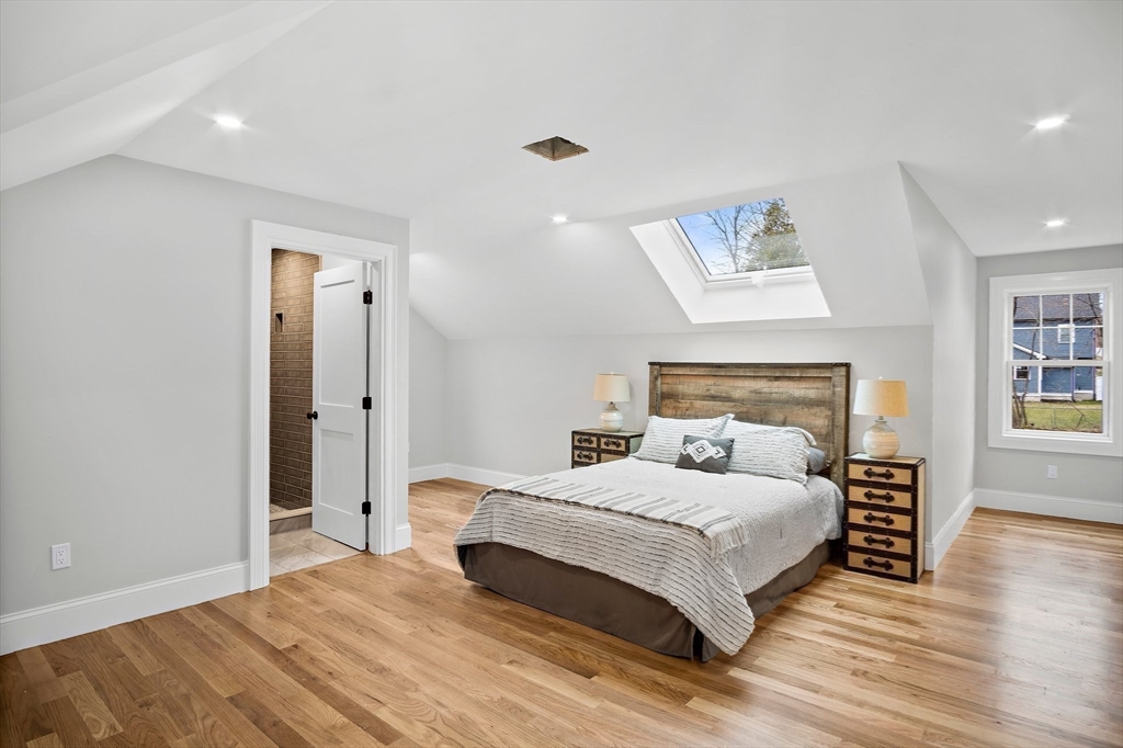 43 Samoset Road Woburn, MA 01801 - Photo 19 of 30 a bedroom with a bed and a night stand