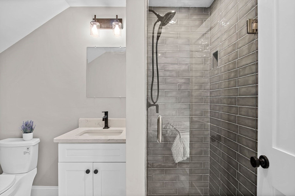 43 Samoset Road Woburn, MA 01801 - Photo 21 of 30 a bathroom with a sink toilet and shower