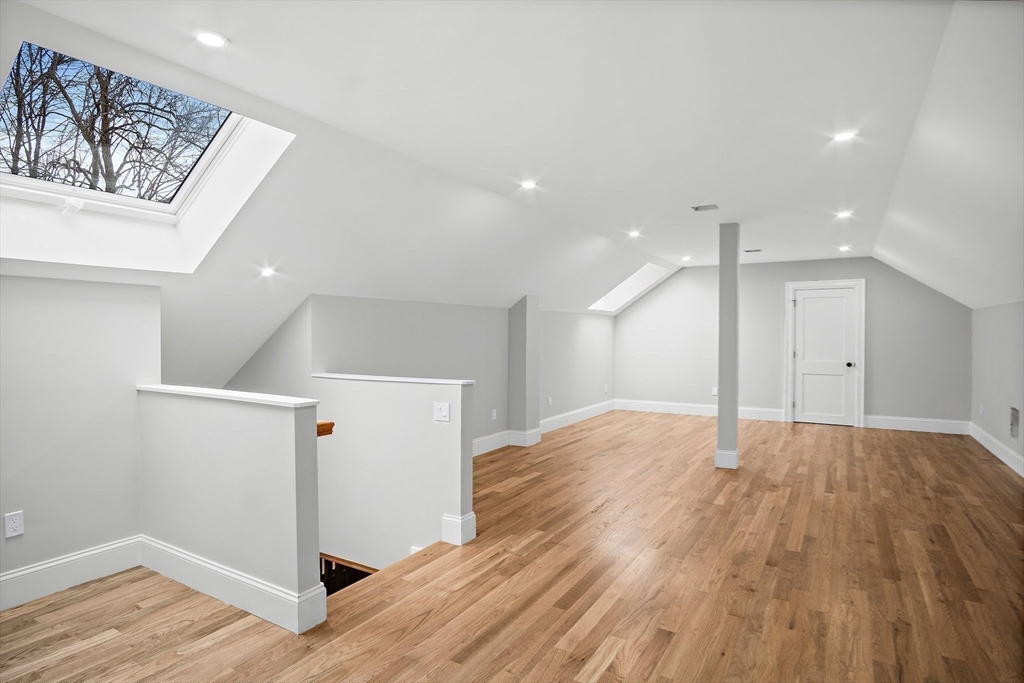 43 Samoset Road Woburn, MA 01801 - Photo 23 of 30 a view of an empty room and wooden floor