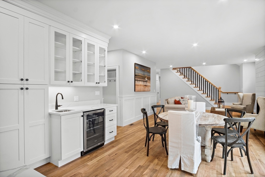 43 Samoset Road Woburn, MA 01801 - Photo 3 of 30 a view of a dining room with furniture and wooden floor