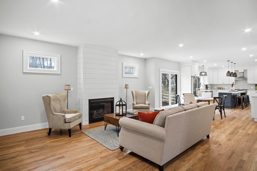 43 Samoset Road Woburn, MA 01801 - Photo 5 of 30 a living room with furniture a fireplace and a table