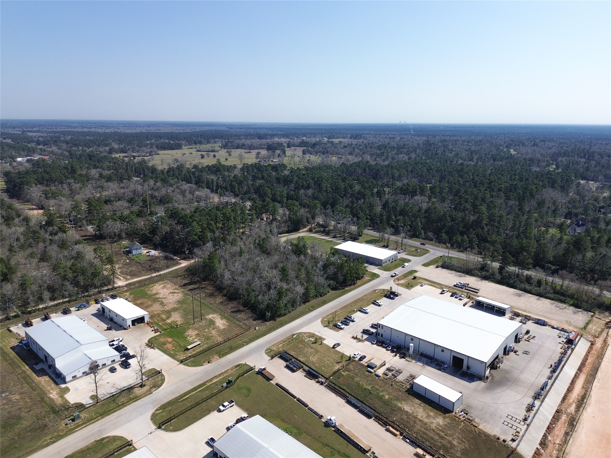 Tbd Cowl Spur Court Conroe, TX 77304 - Photo 11 of 17 an aerial view of a house with a yard