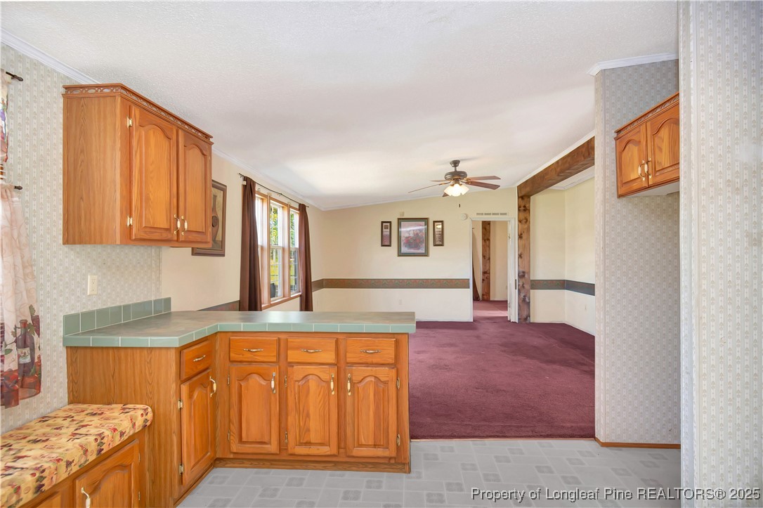 2589 Pleasant Hope Road Fairmont, NC 28340 - Photo 14 of 36 a kitchen with stainless steel appliances granite countertop a stove a sink and a refrigerator