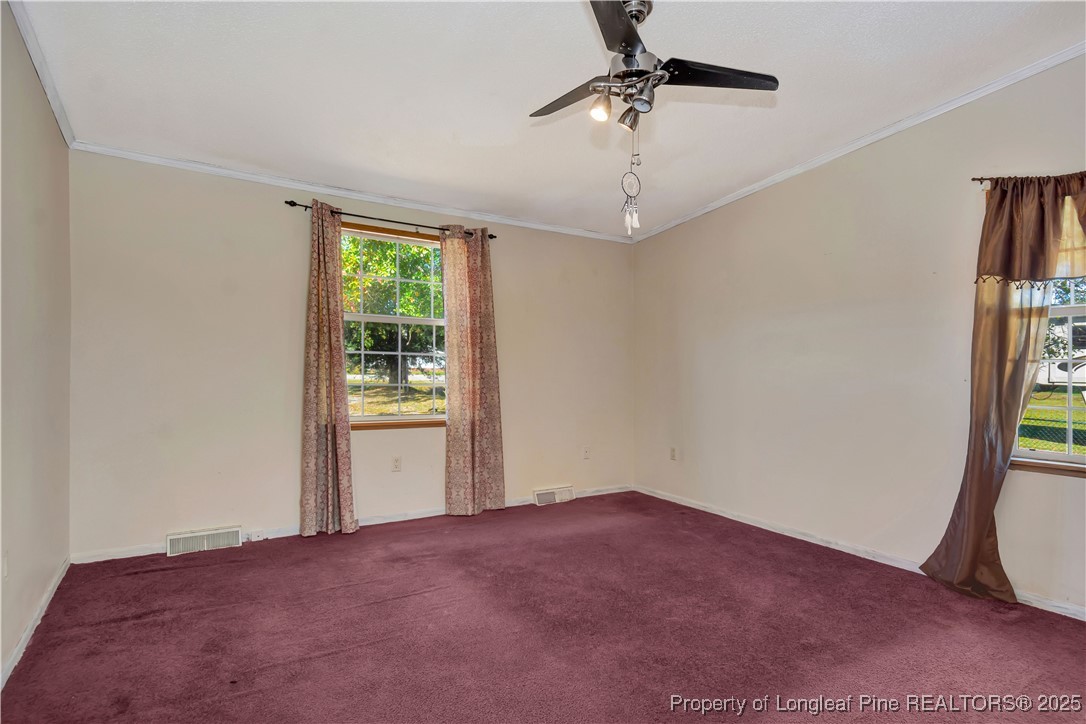 2589 Pleasant Hope Road Fairmont, NC 28340 - Photo 18 of 36 a view of empty room with windows